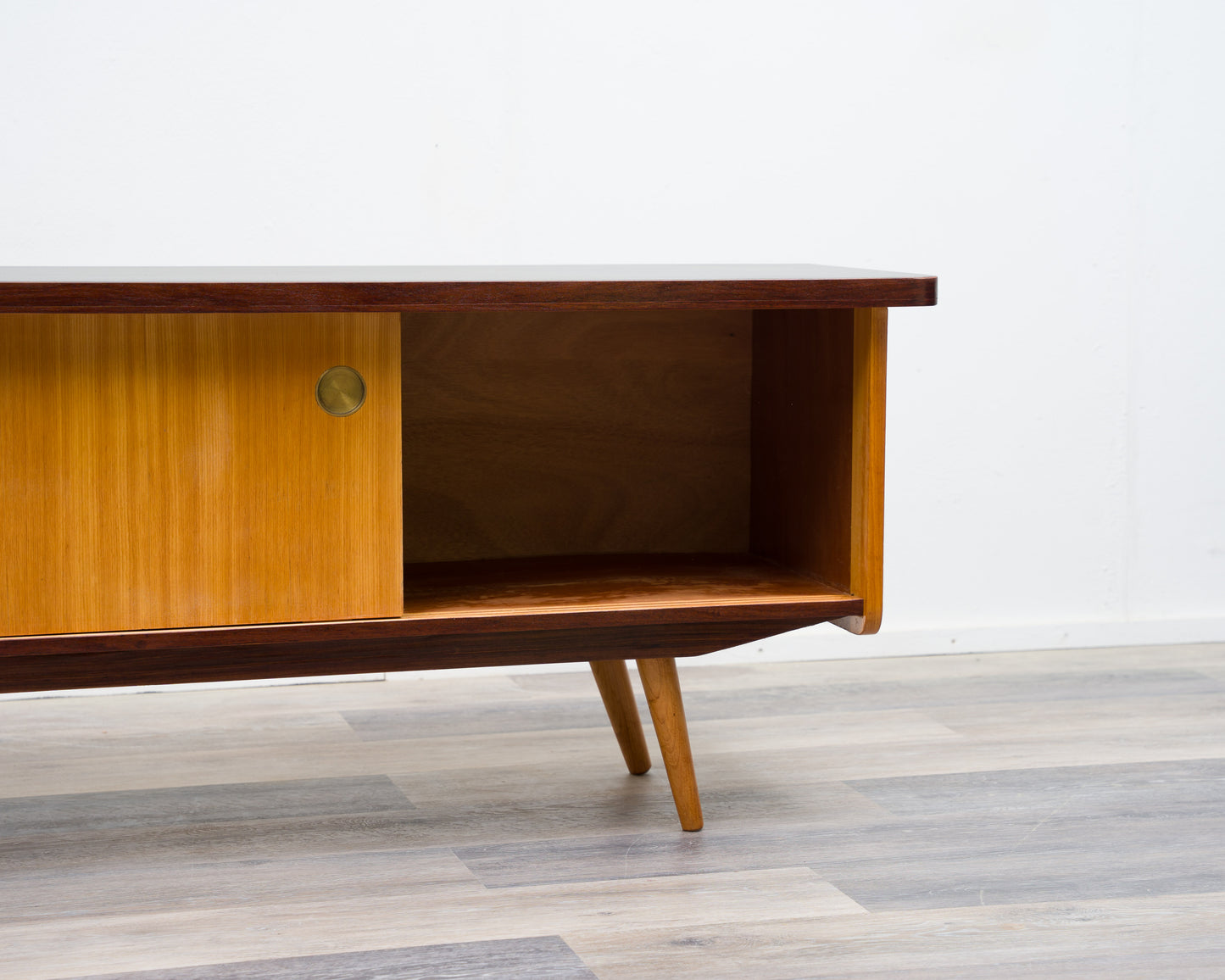 1950s lowboard in ash, surface with black Resopal. Professionally restored