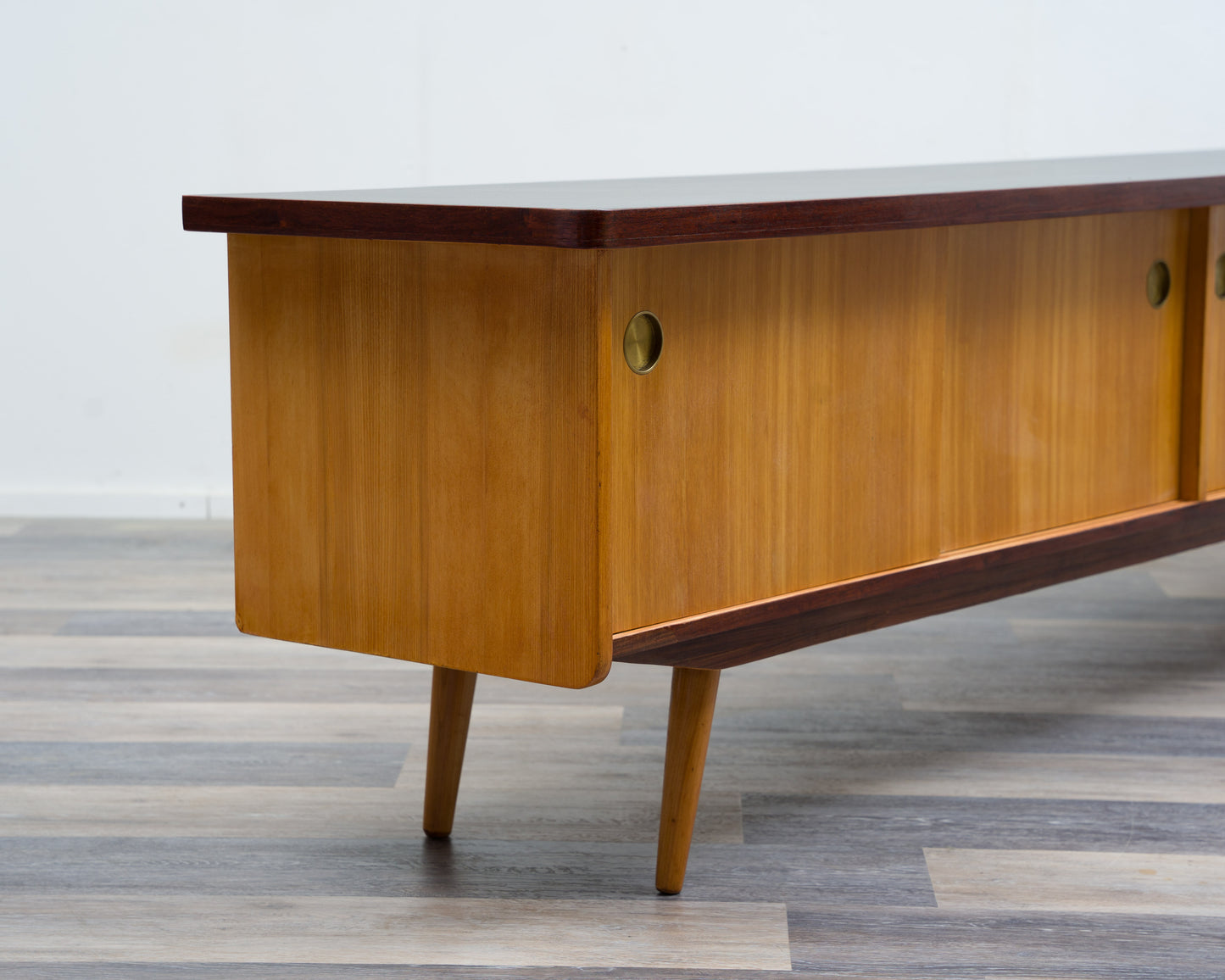 1950s lowboard in ash, surface with black Resopal. Professionally restored