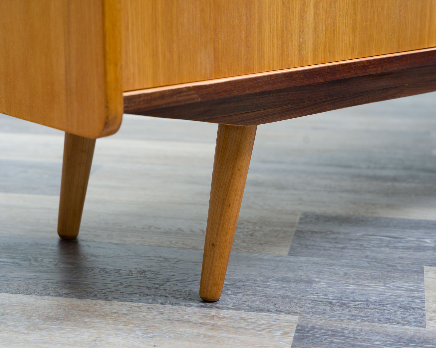 1950s lowboard in ash, surface with black Resopal. Professionally restored