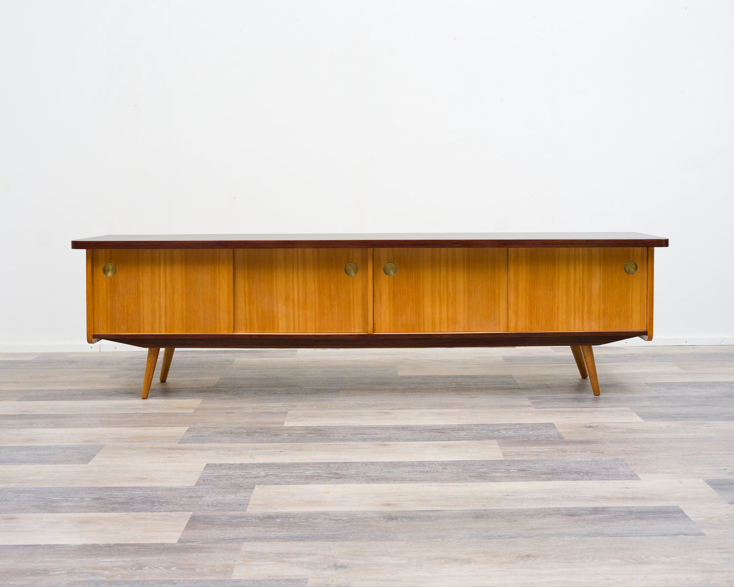 1950s lowboard in ash, surface with black Resopal. Professionally restored