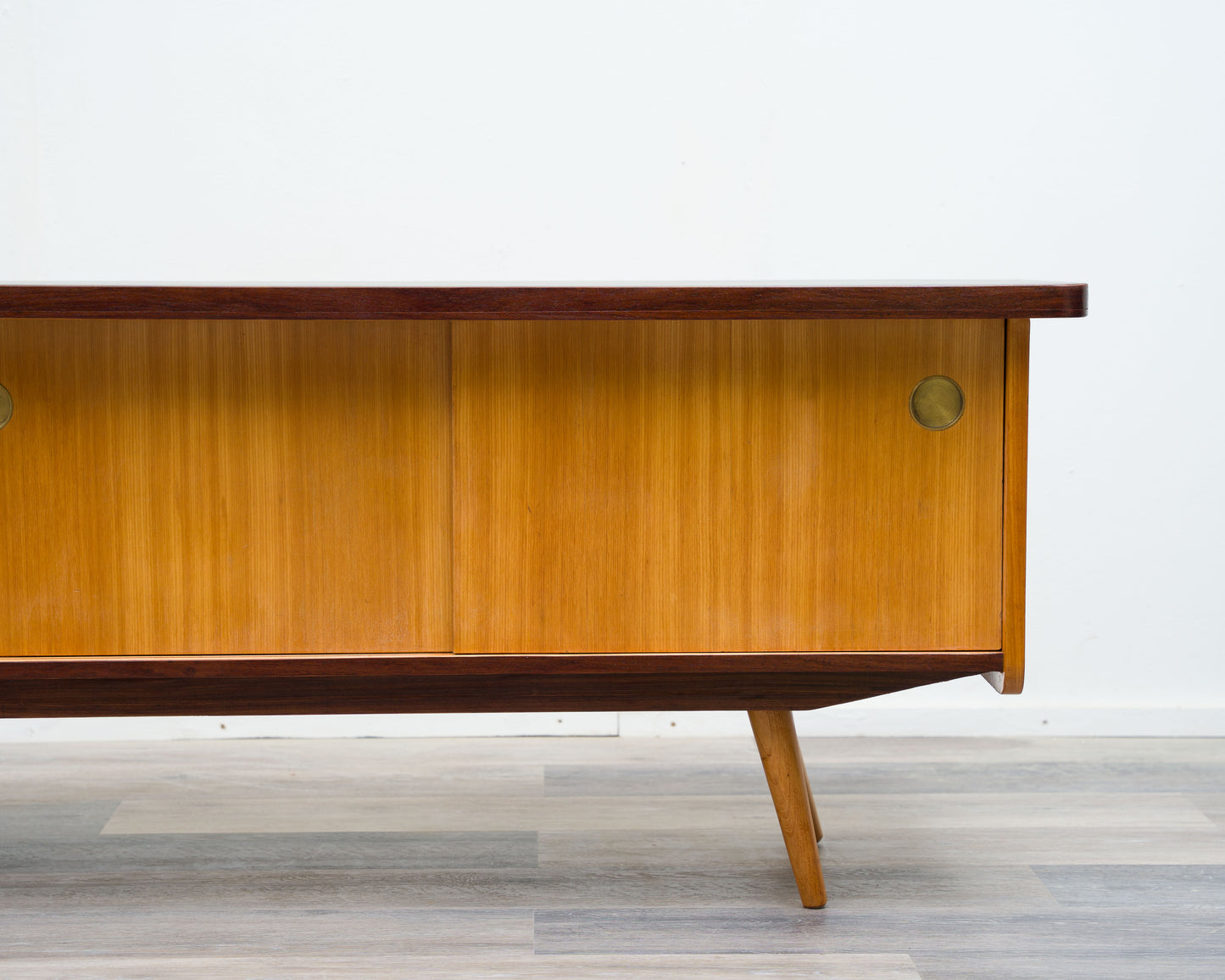 1950s lowboard in ash, surface with black Resopal. Professionally restored