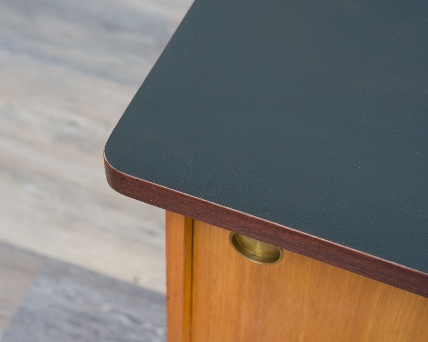 1950s lowboard in ash, surface with black Resopal. Professionally restored
