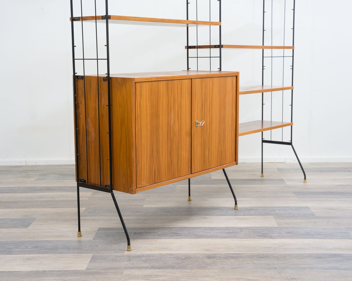 Freestanding shelf, black metal ladders, 60s