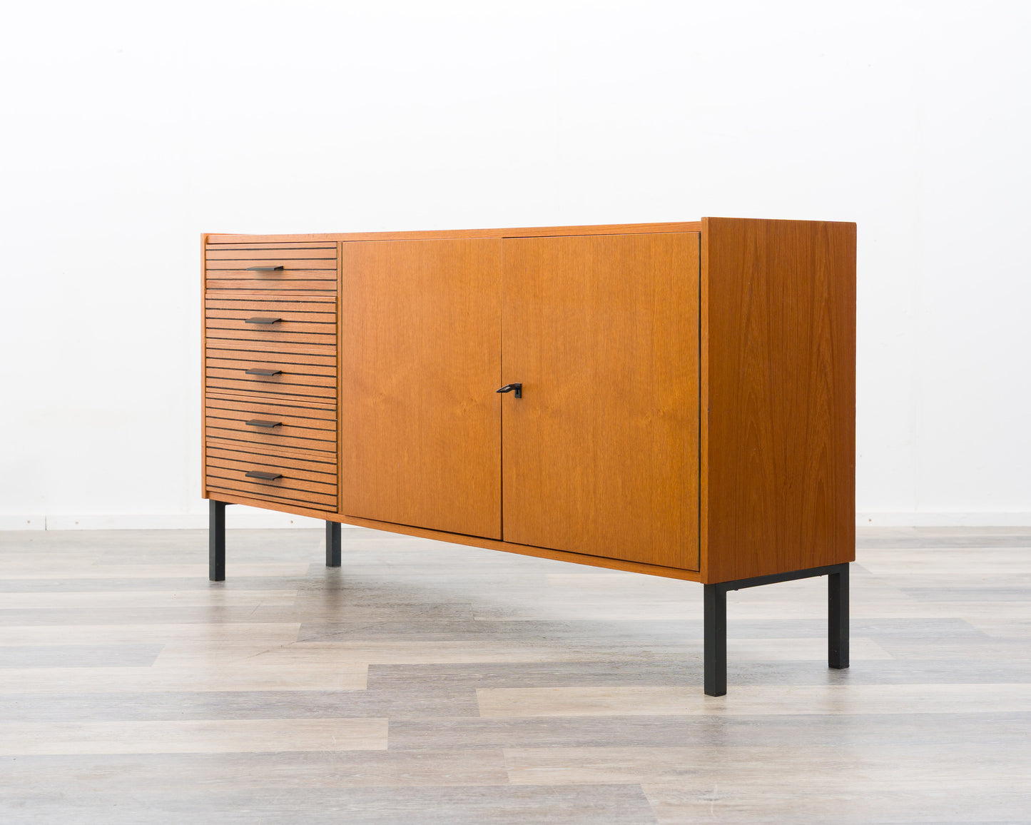 Teak sideboard from the 1960s with grooved drawers.