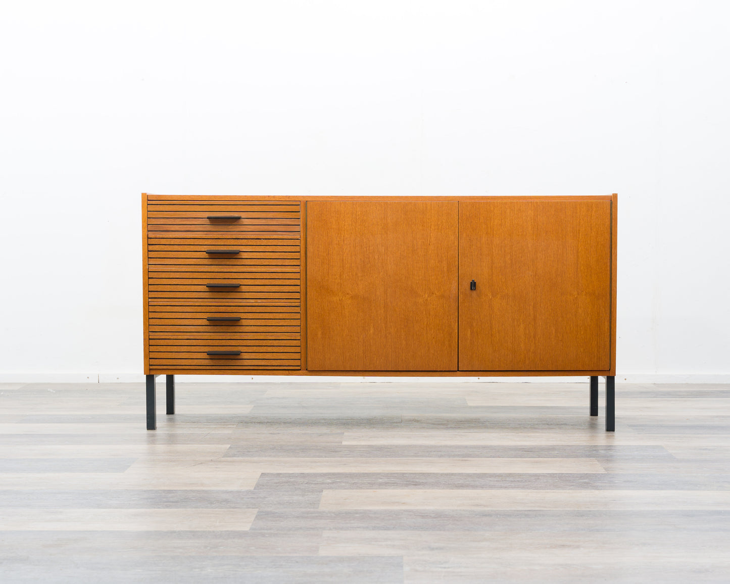 Teak sideboard from the 1960s with grooved drawers.